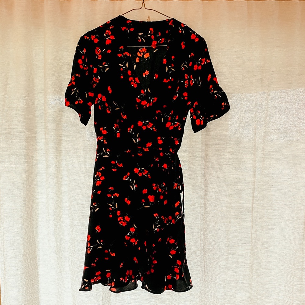 Black wrap dress with red flowers by The Standard